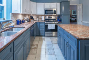 Decorative door end panels on the sides of the wall cabinets adding a designer touch to the kitchen