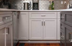 Light gray kitchen cabinet fronts with two main doors and one drawer